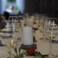 Dukning med blockljus på Åmynnesgården